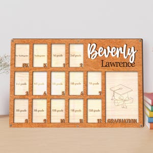 May include: Wooden graduation photo display with spaces for photos from pre-kindergarten to 12th grade. The name "Beverly Lawrence" is displayed in a decorative font. A graduation cap and scroll are etched on the right side.