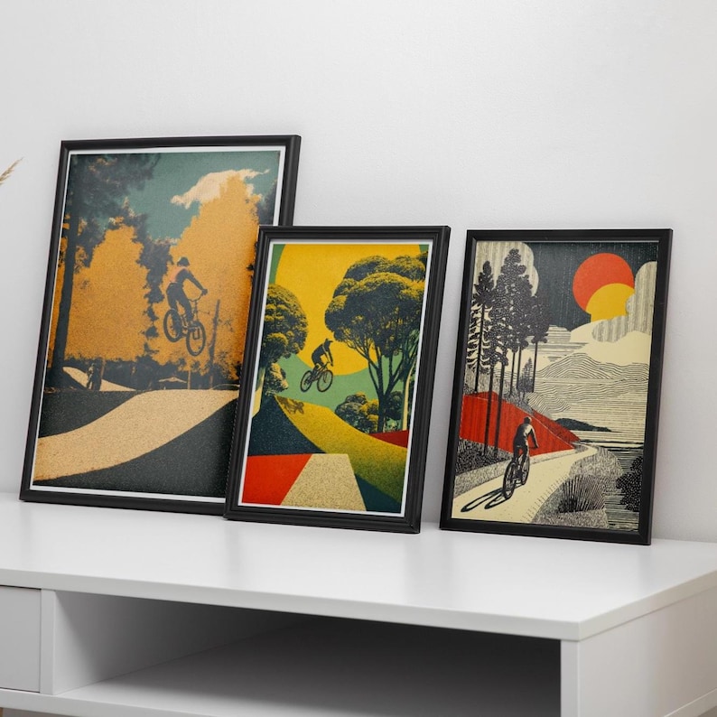 May include: Three framed art prints featuring cyclists on a path. The prints have a vintage style with a color palette of yellow, green, and brown. The artwork depicts cyclists riding on a path with trees and a sun in the background.