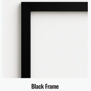 May include: A close-up of a black picture frame with a smooth finish. The frame is rectangular and has a clean, modern design. The text "Black Frame" and "A smooth black finish" are displayed below the frame.