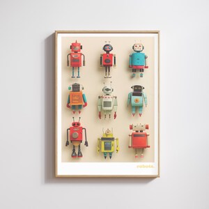 May include: A framed print featuring nine colorful robot illustrations. Each robot has a unique design with various shapes, colors, and details. The word "robots." is printed in the bottom right corner.