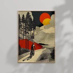 May include: Framed art print featuring a cyclist on a winding road through a stylized landscape. The artwork uses a limited color palette of black, red, and yellow against a beige background. The sun is depicted as a large orange and yellow circle.