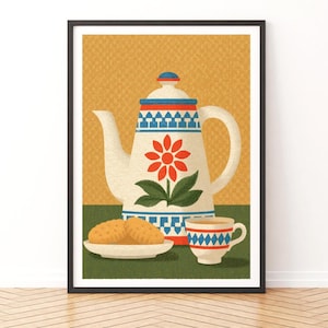 May include: A framed art print featuring a white teapot with a red flower and green leaves, decorated with blue and red geometric patterns. Beside the teapot sits a small plate with two round biscuits and a matching teacup on a green surface.