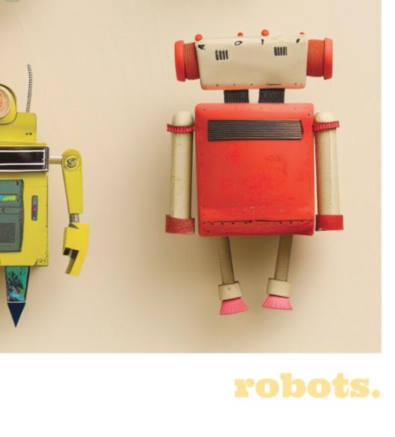 May include: Two colorful robot figures against a cream background. One robot is yellow with a blue and green triangle. The other is red with white and red cylindrical accents. The word "robots" is in yellow text at the bottom.