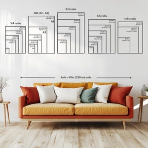 May include: A diagram of paper sizes and aspect ratios, including ISO (A1-A5), 3:4, 2:3, 4:5, and 11:14 ratios. The sofa below is 90 inches wide. The sofa has orange and yellow cushions with white, red, and green pillows.