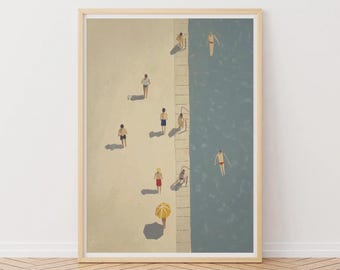 May include: A framed art print depicts a beach scene with people. Figures are walking on a sandy area, and others are swimming in the blue water. A yellow umbrella provides shade. The artwork has a minimalist style.