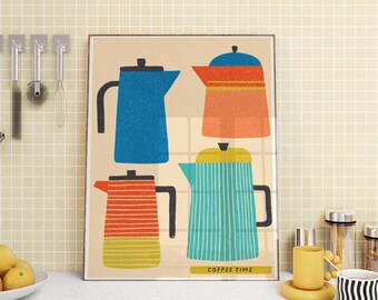 May include: A framed art print showing four brightly coloured coffee pots in blue, orange, and teal. The coffee pots have black handles and lids. The print has the words "COFFEE TIME" in a yellow rectangle at the bottom.