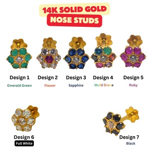 May include: Seven different designs of 14k solid gold nose studs with various colored gemstones. The designs include emerald green, flower, sapphire, multi-stone, ruby, full white, and black.
