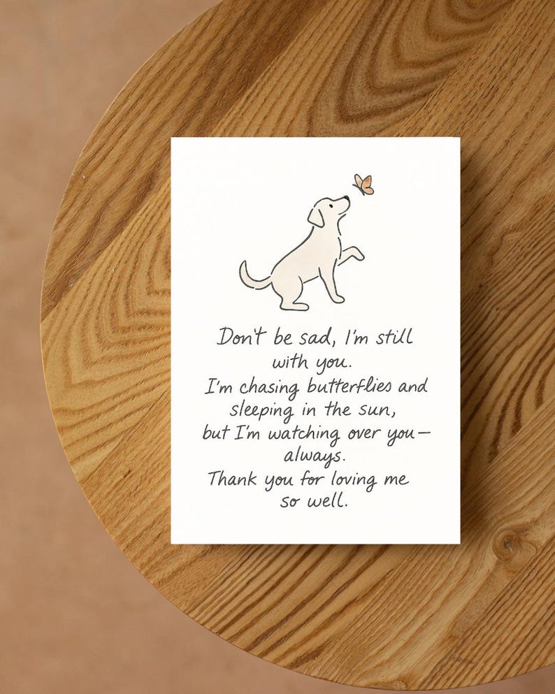 May include: A white card with a dog illustration reaching for a butterfly. The card has text that reads, "Don't be sad, I'm still with you... Thank you for loving me so well."