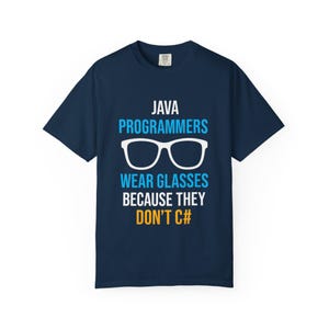 May include: A navy blue t-shirt with white text that reads "JAVA PROGRAMMERS WEAR GLASSES BECAUSE THEY DON'T C#" with a pair of blue glasses above the text.
