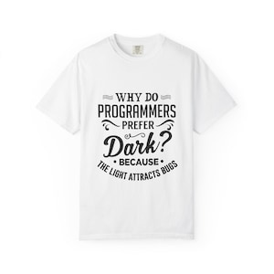May include: White t-shirt with a black graphic that reads "Why do programmers prefer dark? Because the light attracts bugs."