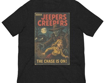 May include: A black t-shirt with a vintage horror movie poster design featuring a creepy figure with a hook hand chasing a woman. The poster reads "Jeepers Creepers" and "The Chase is On!"