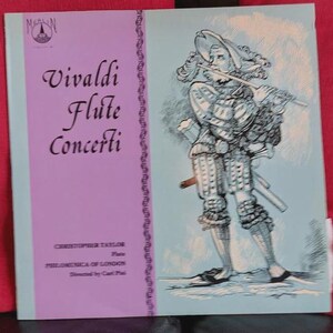 May include: Vintage vinyl record album cover for Vivaldi Flute Concerti. The cover features a purple panel with the title and artist information, and a light blue panel with an illustration of a man playing a flute.