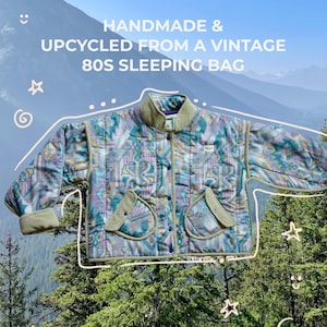 May include: Handmade and upcycled jacket from a vintage 80s sleeping bag. The jacket features a colorful geometric pattern in shades of blue, purple, and green. It has a ribbed collar and cuffs, and two front pockets. The text on the image reads: "HANDMADE & UPCYCLED FROM A VINTAGE 80S SLEEPING BAG."