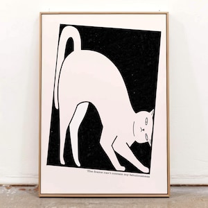 May include: A framed art print featuring a white cat silhouette against a black background. The cat is arched, with its tail up and paws extended. The text at the bottom reads, "The frame can't contain my fabulousness."