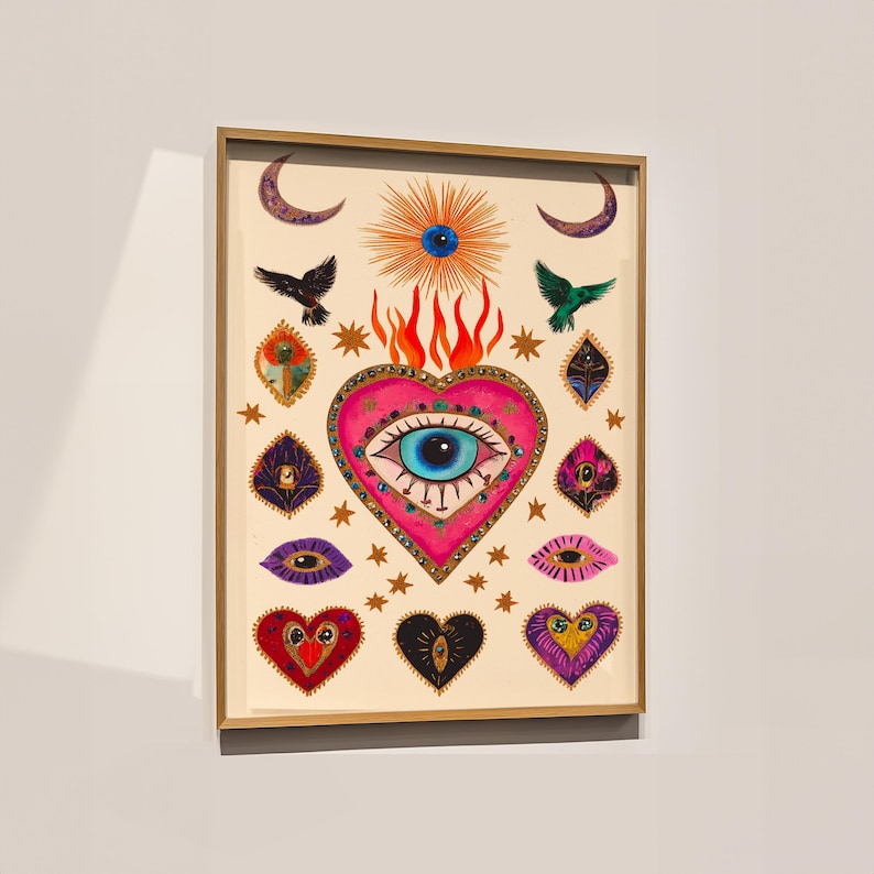 A vibrant mystical poster featuring a flaming heart with a central blue evil eye surrounded by celestial symbols, stars, moons, and birds. Embellished with jewel-like details and bright colors, this maximalist artwork blends folk art and spiritual symbolism, making it a bold bohemian wall decor piece.Mystical Eye Art, Spiritual Decor, Celestial Folk Print, Bohemian Wall Art, Protective Eye Print, Dopamine Decor, Maximalist Art, Sacred Heart Art, Colorful Mystical Decor, Eclectic Spiritual Print