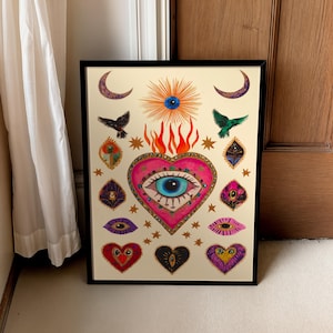 A vibrant mystical poster featuring a flaming heart with a central blue evil eye surrounded by celestial symbols, stars, moons, and birds. Embellished with jewel-like details and bright colors, this maximalist artwork blends folk art and spiritual symbolism, making it a bold bohemian wall decor piece.Mystical Eye Art, Spiritual Decor, Celestial Folk Print, Bohemian Wall Art, Protective Eye Print, Dopamine Decor, Maximalist Art, Sacred Heart Art, Colorful Mystical Decor, Eclectic Spiritual Print