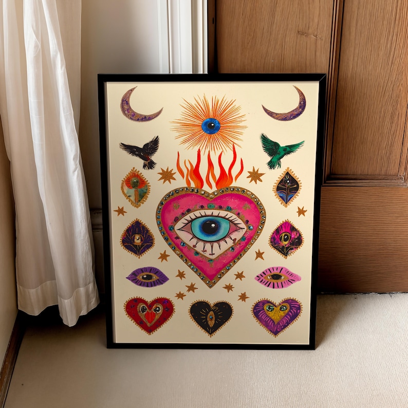 A vibrant mystical poster featuring a flaming heart with a central blue evil eye surrounded by celestial symbols, stars, moons, and birds. Embellished with jewel-like details and bright colors, this maximalist artwork blends folk art and spiritual symbolism, making it a bold bohemian wall decor piece.Mystical Eye Art, Spiritual Decor, Celestial Folk Print, Bohemian Wall Art, Protective Eye Print, Dopamine Decor, Maximalist Art, Sacred Heart Art, Colorful Mystical Decor, Eclectic Spiritual Print