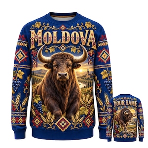 May include: A blue long-sleeve sweatshirt featuring a central graphic of a brown bull, the text "MOLDOVA" at the top, and a landscape with vineyards and wheat. The sleeves and hem have decorative patterns of grapes, wheat, and geometric shapes.