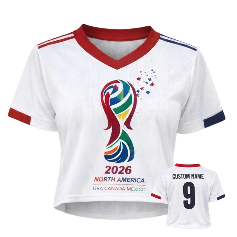 May include: White cropped soccer jersey with red and blue accents. Features a colorful graphic and the text "2026 NORTH AMERICA USA CANADA MEXICO". A smaller jersey shows a custom name and the number 9.