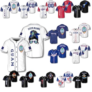 May include: A collection of baseball jerseys in various colors, including white, blue, red, and black. The jerseys feature the word "GUAM" and other text, along with graphic designs. Some jerseys have the text "YOUR NAME" and numbers.