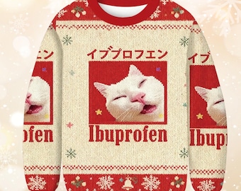 May include: A cream-colored Christmas sweater with a red collar and cuffs. The sweater features a white cat face graphic inside a red square, with the word "Ibuprofen" below. Japanese text is above the cat graphic. Snowflake and star patterns decorate the sweater.