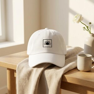May include: A set of three ceramic mugs with a speckled, matte finish. The mugs are in shades of cream, light brown, and dark brown. Each mug has a simple, minimalist design, ideal for coffee or tea.