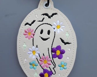 Embroidered ghost oval bag tag