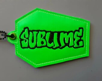 Coffin shaped bag tag Sublime