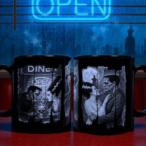 May include: Two black ceramic mugs with a spooky theme. One mug features a diner scene with the text "DINE" and "OPEN", and the other mug shows a couple embracing. Both mugs have a black handle and a black interior.