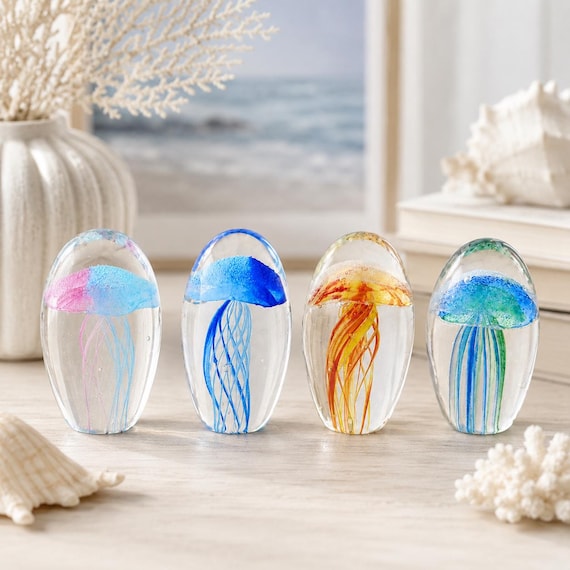 Delicate hand-blown glass jellyfish that look like they're floating mid-air — each one is a tiny, one-of-a-kind ocean sculpture.
