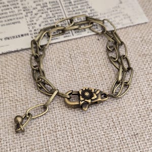 Dikke antieke koperen paperclipketting met oversized karabijnsluiting