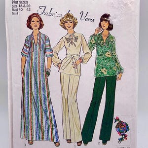 May include: Vintage Simplicity sewing pattern 7466 featuring three women's fashion designs. The pattern includes a striped maxi dress, a cream-colored pantsuit, and a floral print blouse with green pants. The pattern includes two sizes.