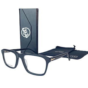 May include: Black rectangular-framed eyeglasses, presented with a black case and two black pouches. The glasses feature a gold detail on the temples. The case and pouches have a white logo.