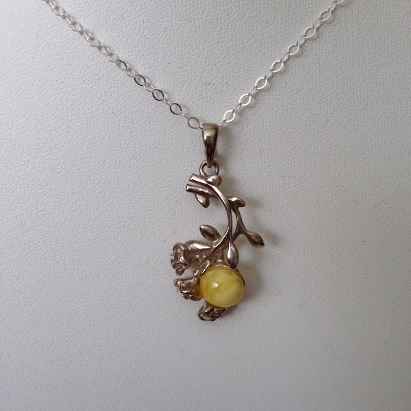 Milky Amber Pendant With Silver Flowers