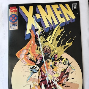 May include: A Marvel Comics X-Men comic book, issue number 38, dated November. The cover features a dynamic illustration of characters in yellow and brown costumes fighting with a staff against a large circular background. The title reads X-MEN.