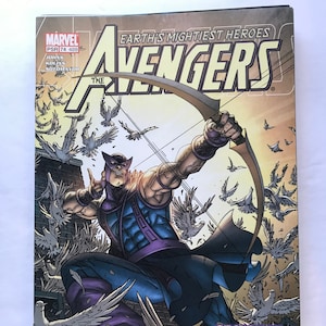 May include: Comic book cover featuring a superhero with a bow and arrow, standing on a rooftop with a flock of white doves flying around him. The cover is titled "The Avengers" and features the text "The Search for She-Hulk, Part 3".