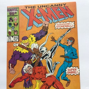 May include: A comic book cover featuring the X-Men. The cover is yellow with a group of superheroes in the center. The title "The Uncanny X-Men" is at the top of the cover. The text "Introducing--Stonewall!" is in a speech bubble in the upper right corner. The text "Super Sabre!" is in a speech bubble in the lower right corner. The text "And Crimson Commando!" is in a speech bubble in the lower center of the cover.