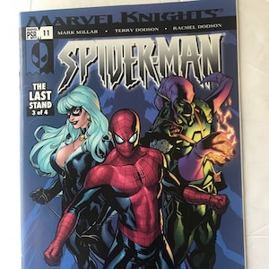 May include: Comic book cover featuring Spider-Man, Black Cat, and Green Goblin. The cover is blue with a red and black Spider-Man in the center. The text "The Last Stand 3 of 4" is in the top left corner. The text "Marvel Knights" is in the top center. The text "Spider-Man" is in the center top. The text "Mark Millar, Terry Dodson, Rachel Dodson" is in the center bottom.