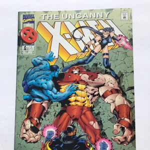 May include: Comic book cover featuring the X-Men characters, including the Juggernaut, Beast, and a female character with purple hair. The cover is green, red, and blue with the text "The Uncanny X-Men" and "Who Stopped The Juggernaut?"