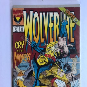May include: A comic book cover featuring Wolverine, a superhero with claws, in a fight with Sabretooth, another superhero with claws. The cover is red, yellow, and blue with the title "Wolverine: Cry of Madness" and the text "30th Anniversary The Fantastic Four 1961-1991".