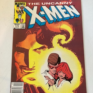 Puede incluir: Un cómic vintage titulado "The Uncanny X-Men" con una ilustración de portada con Cíclope y Jean Grey. La portada tiene un esquema de color marrón y amarillo con el logotipo de Marvel Comics.