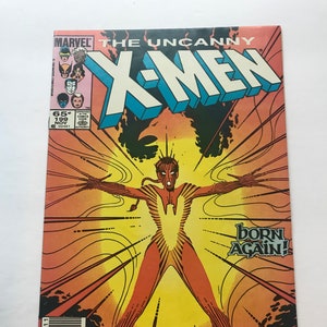 以下が含まれることがあります： 「アンキャニーX-MEN」のヴィンテージコミックの表紙。赤とオレンジ色の中心人物がエネルギーを放射しています。「X-MEN」のタイトルは太字の青と白の文字です。表紙には「BORN AGAIN！」のテキストとマーベルコミックのロゴが含まれています。
