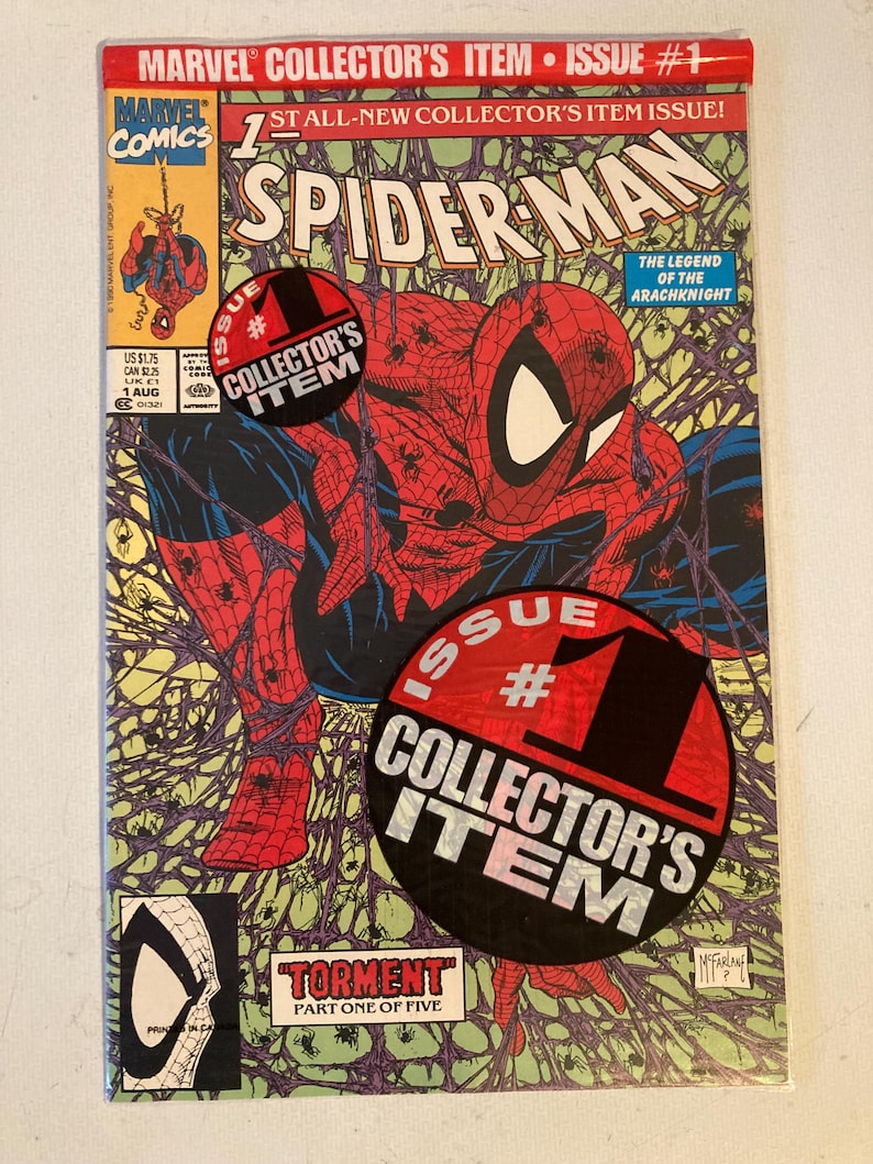 May include: A Marvel Comics Spider-Man issue number one comic book titled Torment Part One of Five. The cover features a red and blue costumed character amidst purple spider webs, with two circular black and red Collector's Item stickers.