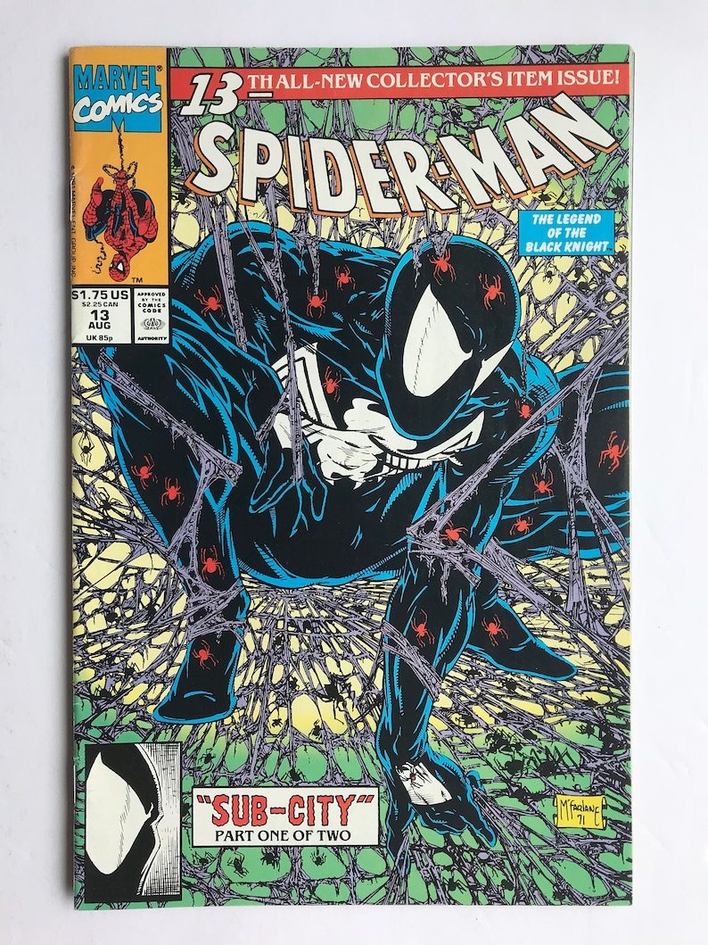 May include: A Marvel Comics Spider-Man issue 13 comic book featuring a black-suited character crouching amidst a web covered in small red spiders. The cover includes the text 13th ALL-NEW COLLECTOR'S ITEM ISSUE, SPIDER-MAN, and SUB-CITY PART ONE OF TWO.
