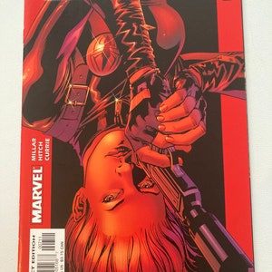 May include: The Ultimates comic book cover, issue number 7, featuring a woman with red hair holding a gun, with the title "The Ultimates" in large, white letters.