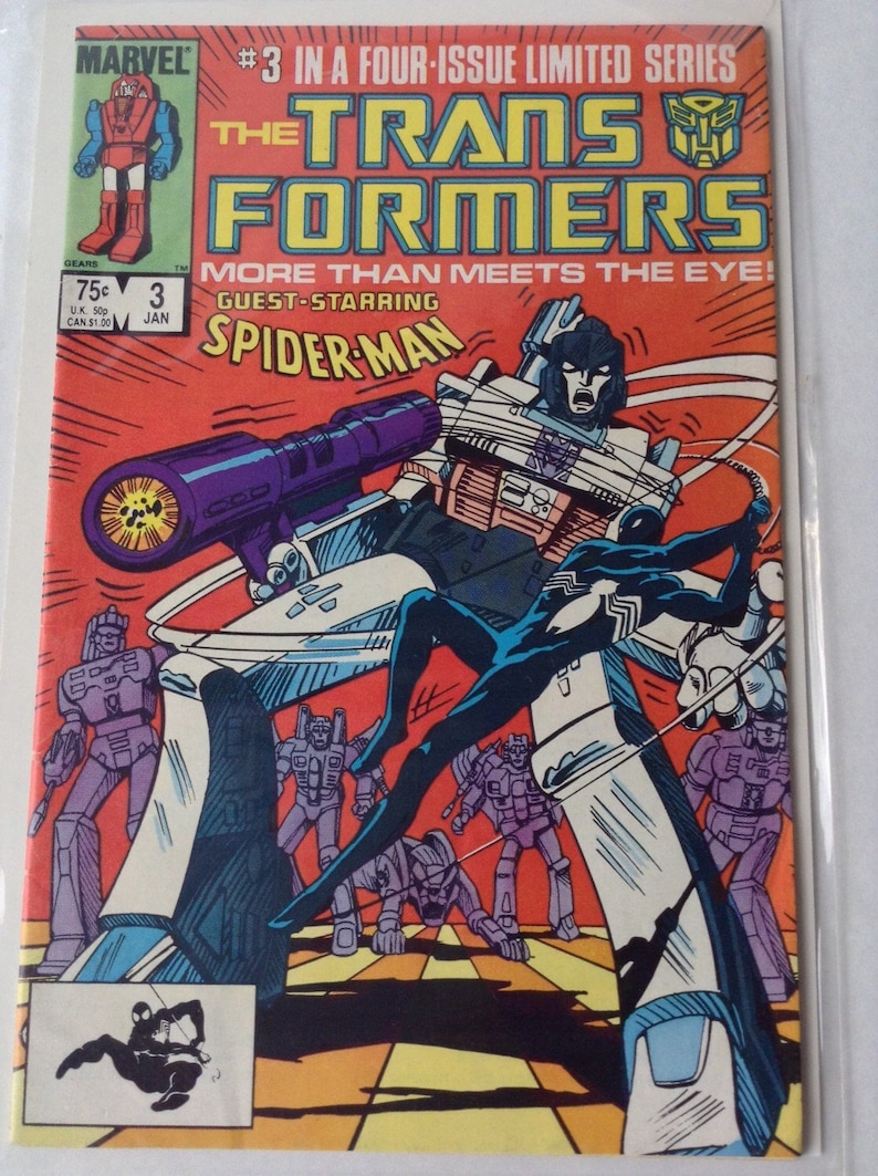 May include: Comic book cover for The Transformers #3, featuring guest star Spider-Man. The cover art shows a battle scene with robots and Spider-Man in action against a red background. The Marvel and Transformers logos are visible.