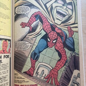 May include: A comic book page featuring Spider-Man in a red and blue suit crouching in a bathroom, with a large, menacing Hobgoblin face looming above. Speech bubbles contain dialogue, and the text at the bottom reads THE CHALLENGE OF HOBGOBLIN!