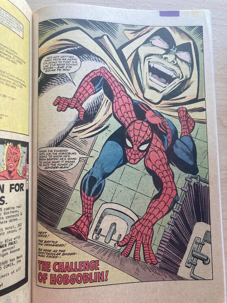May include: A comic book page featuring Spider-Man in a red and blue suit crouching in a bathroom, with a large, menacing Hobgoblin face looming above. Speech bubbles contain dialogue, and the text at the bottom reads THE CHALLENGE OF HOBGOBLIN!