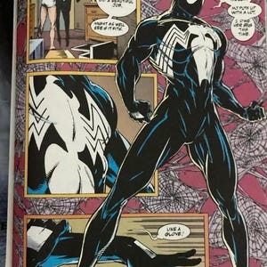 May include: A comic book page featuring Spider-Man in a black suit with a large white spider emblem on the chest. The panels show the character standing, a close-up of the emblem, and a hand, with speech bubbles containing text about his marriage.