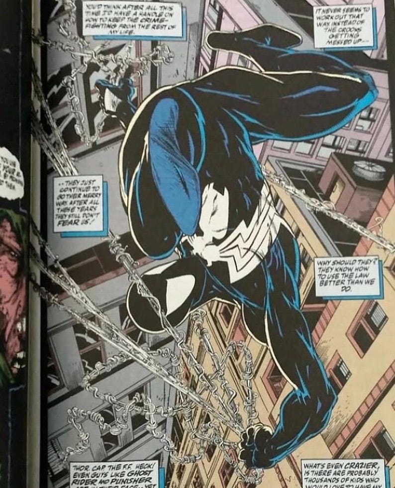 May include: A comic book panel illustration featuring a character in a black suit with a white spider emblem, swinging through a city on silver chains. The character is depicted in a dynamic pose above buildings, surrounded by several text boxes.